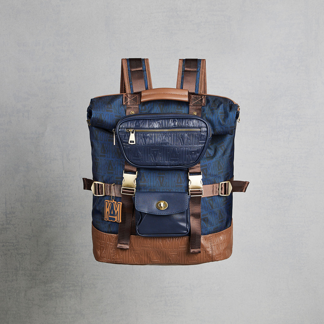 Waxed canvas backpack with roll up top and hand waxed leather bottom and  outside pocket